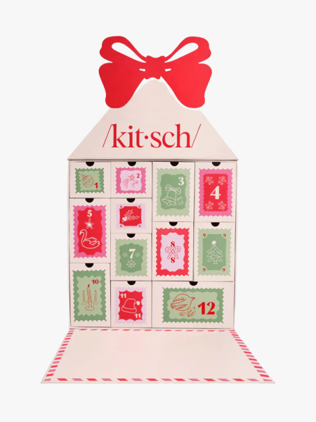 Kitsch North Pole Post 12 Day Advent Calendar in branded calendar with multiple components on a light gray background